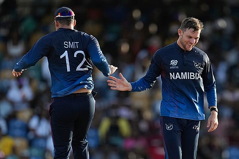 Gerhard Erasmus celebrates Michael Jones's wicket